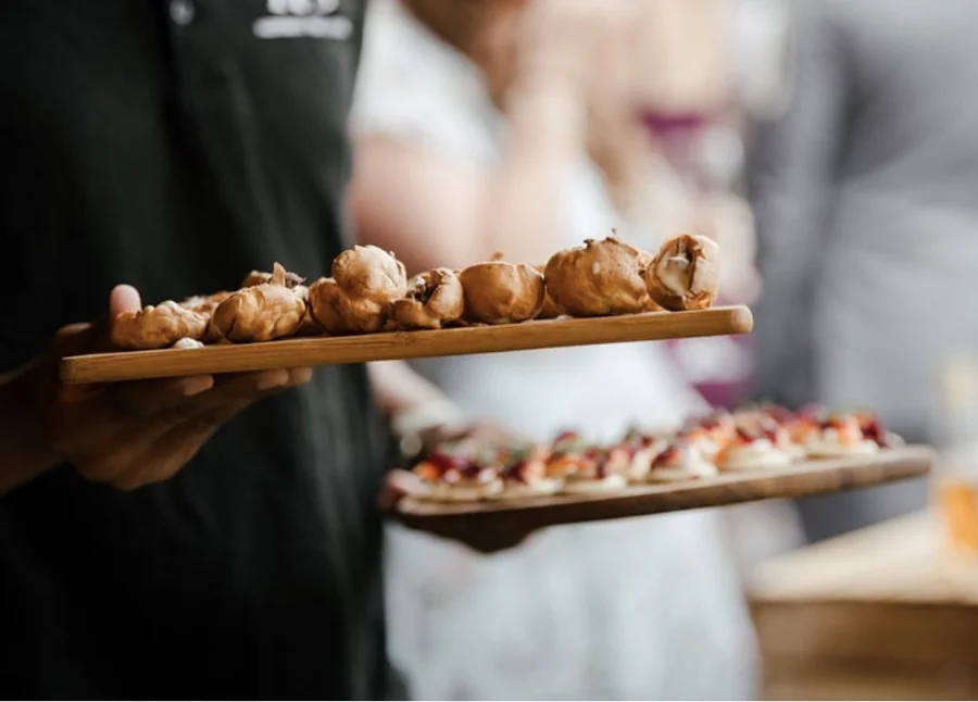 HGFD catering staff serving canapés at an outdoor Yorkshire wedding