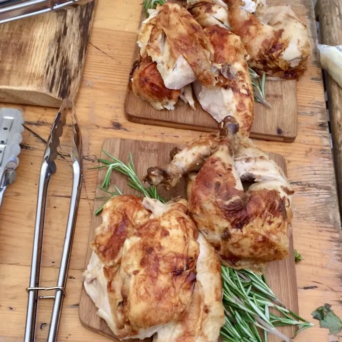 Rotisserie chicken on boards with rosemary, Harrogate Food and Drink Co catering