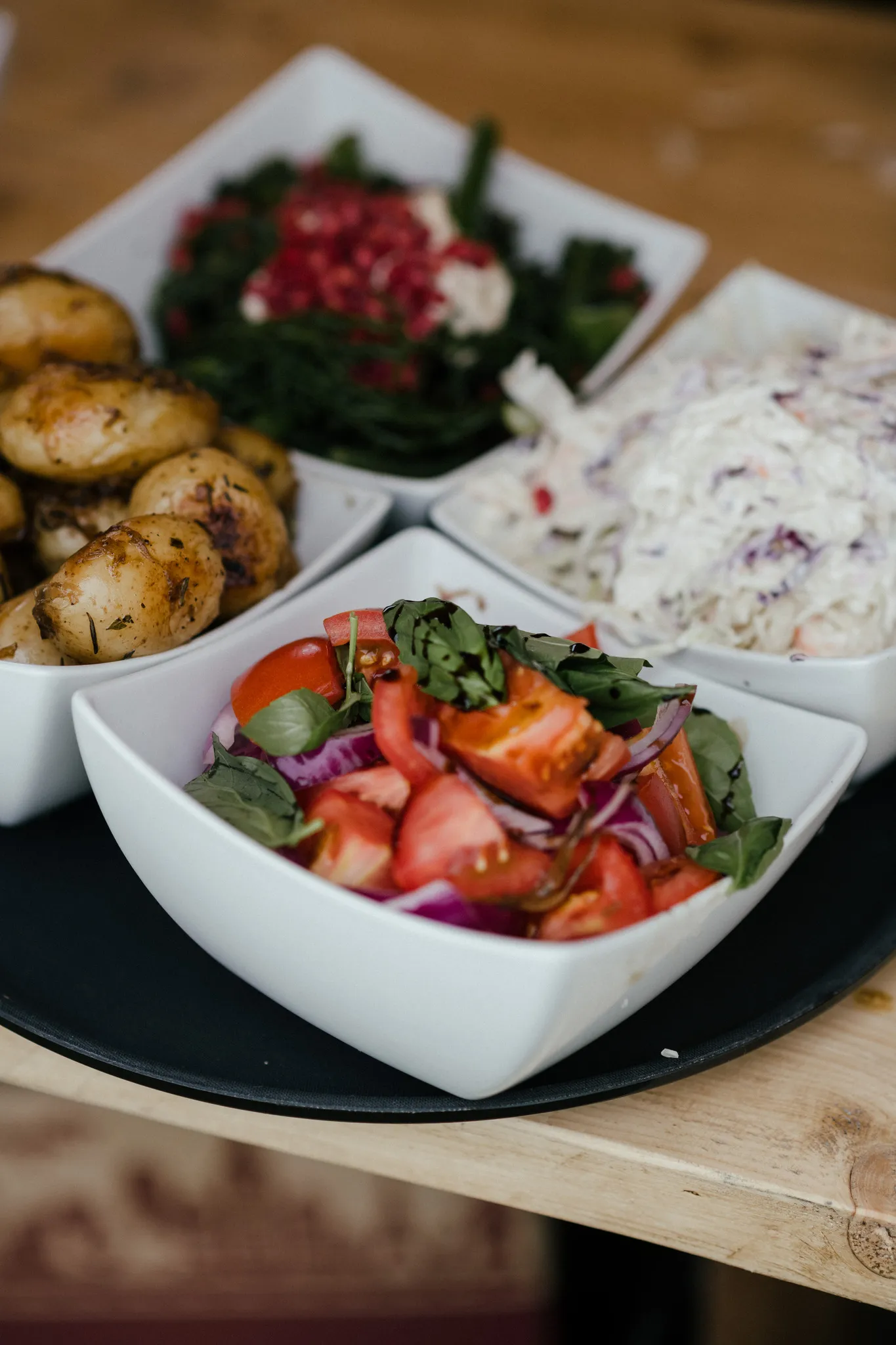 Sharing salads in white bowls at a Yorkshire wedding reception