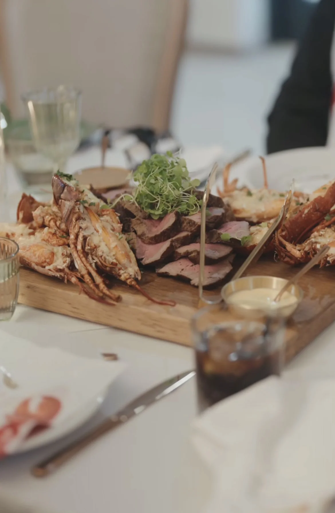 Lobster and beef sharing board on a white-linen table at a Yorkshire formal dinner
