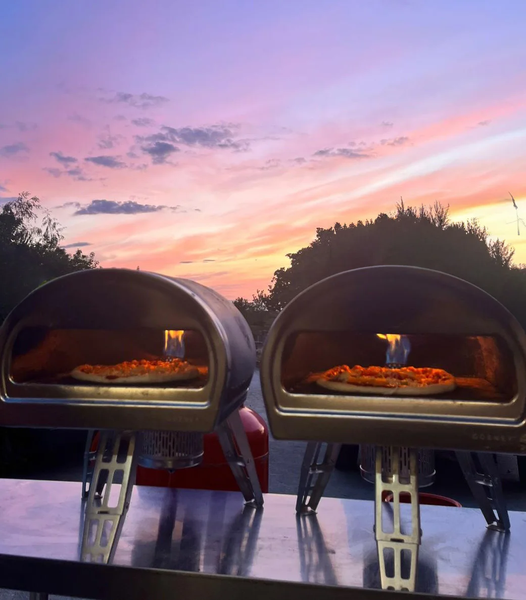 Pizza ovens at sunset at an outdoor Yorkshire wedding