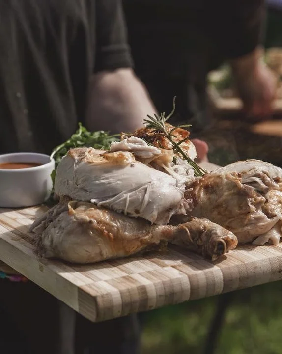 Rotisserie chicken quarters on boards, outdoor catering by Harrogate Food and Drink Co