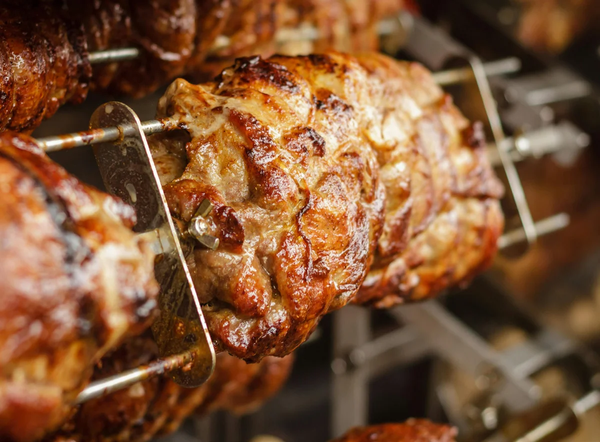 Rotisserie spit roast at a Yorkshire outdoor catering event by Harrogate Food and Drink Co