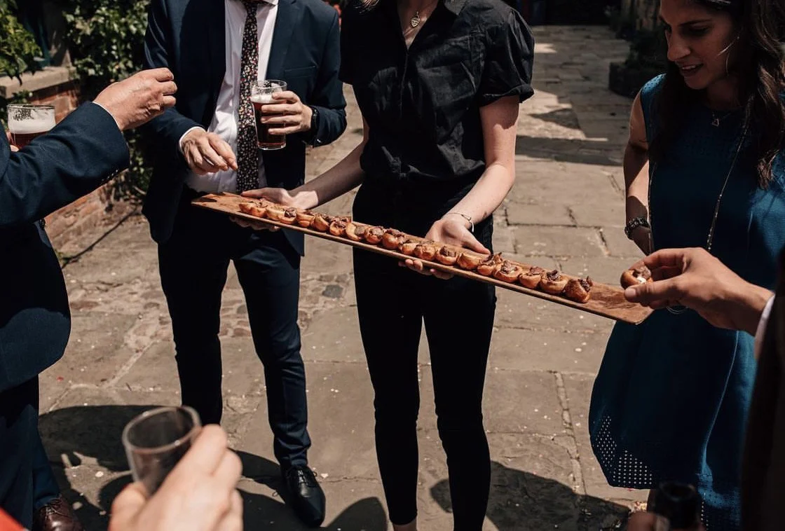 HGFD team passing canapés at an outdoor Yorkshire wedding event